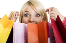 Excited Shopping Woman isolated on white
